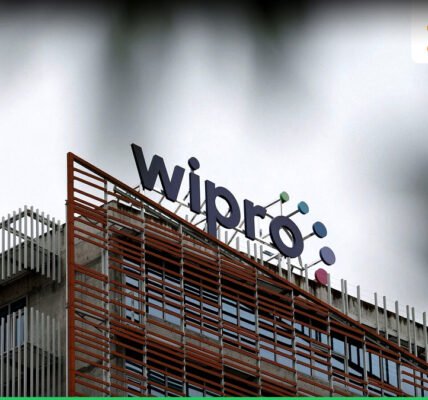 Wipro ലോഗോയും ഓഹരി വിപണിയുടെ ചാർട്ടുകളും കാണിക്കുന്ന ചിത്രം.
