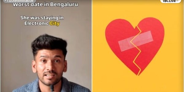 ട്രാഫിക്കിൽ കുടുങ്ങിയ ഒരു യുവാവ് നിരാശയോടെ ഫോണിൽ നോക്കുന്നു