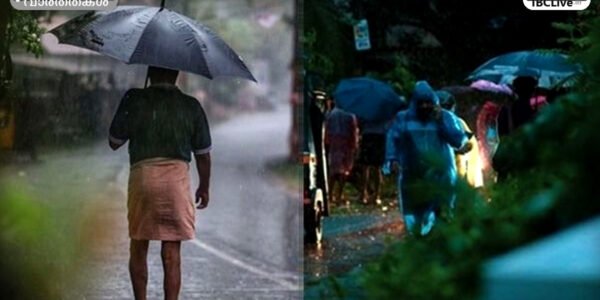 കേരളത്തിൽ ശക്തമായ മഴ പെയ്യുന്ന ഒരു ചിത്രം. റോഡിലൂടെ വാഹനങ്ങൾ പോകുന്നു, ആളുകൾ കുട ചൂടി നടക്കുന്നു.